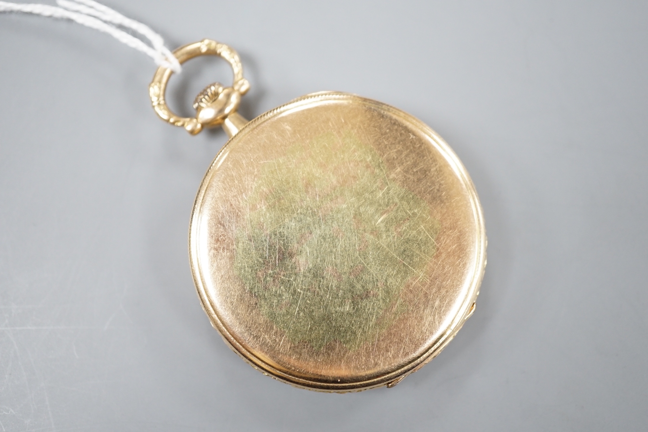 An early 20th century Swiss yellow metal open faced keyless dress pocket watch, retailed by Kinnear & D'Esterre, case diameter 44mm, gross 52 grams.